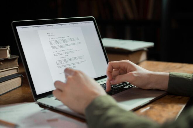 person typing on a laptop